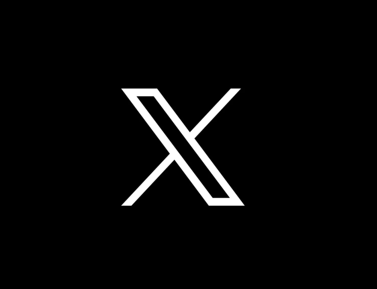 X_com