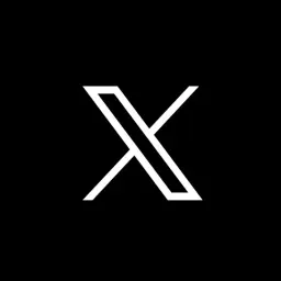 X_com